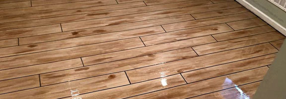 This image shows a floor that has a wood stain coating.