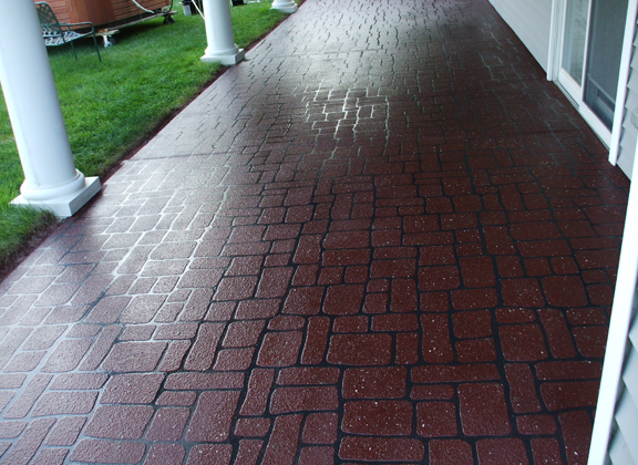 This image shows a patio with stained concrete.