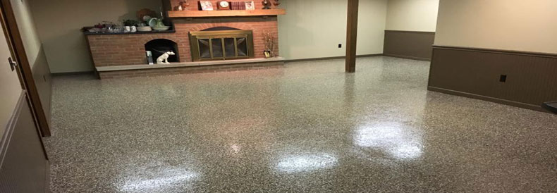 This image shows a Basement Floor with flake epoxy paint.