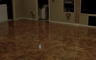 This image shows a Basement Floor with brown metallic epoxy paint.