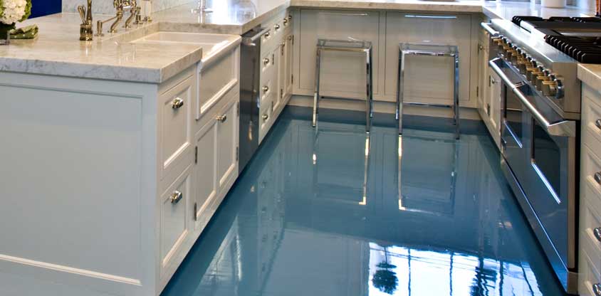 This image shows a kitchen with metallic epoxy floor.